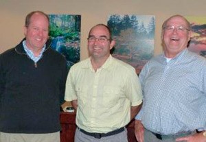 Flanked by county councilmen Rick Hughes