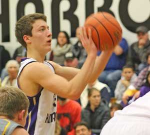 Peter Strasser drops in a free throw in an early season home game against Burlington Edison. Strasser scored 19 points to lead the Friday Harbor offense in a 8-point loss