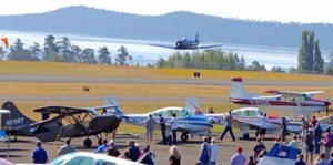 A WWII-era fighter plane commands attention as it makes a low pass over the runway at the 5th annual Friday Harbor Fly In and Community Open House