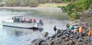 Using a sheriff's boat to help clear the debris