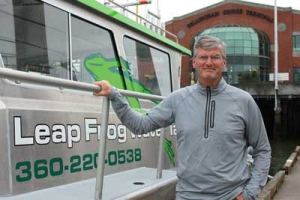 Bill McGown of Leap Frog Water Taxi stands beside his boat