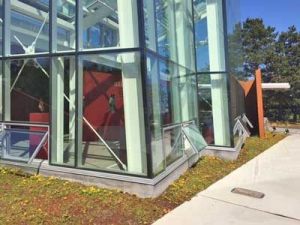 Spring Street’s sidewalk passes by the IMA’s atrium
