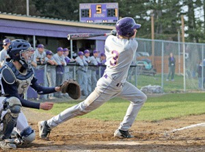 Second baseman Casey Rothlisberger rips a base hit in the Wolverines win over Lynden Christian