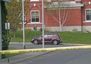 A PT Cruiser carrying items found in a garage that are suspected to be explosives sits outside the county courthouse Sunday afternoon
