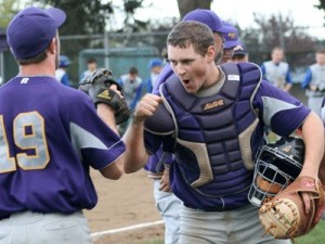 Friday Harbor's Alex Jangard readies a fist-pump in  celebration of the Wolverines 14-4 victory over Bellevue Christian at home Thursday in the Tri-District playoff opener. Friday Harbor