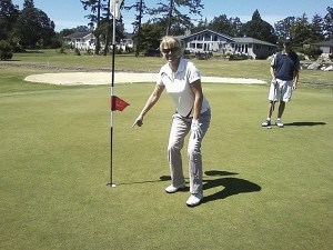 Meg Drye points to the cup on the No. 8
