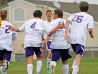 The Friday Harbor boys soccer team celebrates a goal by Javier Gomez