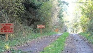 Homemade signs line the edge of Fieldstone Road