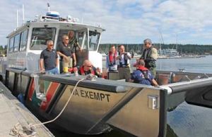 Local officials get acquainted with the equipment and operation of San Juan County Sheriff Department's new public safety boat