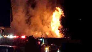 A tower of smoke and flames pour out into the pre-dawn sky as fire sweeps through Downriggers Restaurant in the early morning hours of Aug. 17.