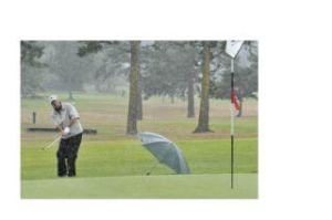 Fred Weedon of Lopez Island chips toward the hole in Saturday’s best ball competion. He and John Bird were tied for third place going into Sunday’s round