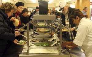 The line winds up out the front doors of the high school as people flock to the nearly monthly community dinners that benefit the Food for Thought program. Dinner is made from scratch with the help of students in the Chef 1.0 work-based class.