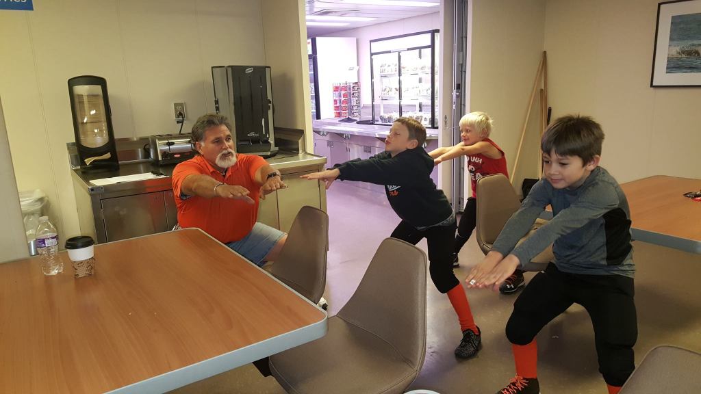 Little league football teams win championship trophies