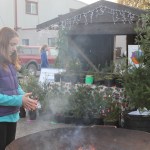 Staff photo/Hayley Day                                A girl warms herself by the fire at Brickworks Old-Fashioned Christmas Market.
