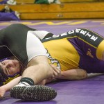 Staff photo/Greg Sellentin                                Senior Hunter Rustad sets up and locks in an arm bar on his way to a pin against Concrete.