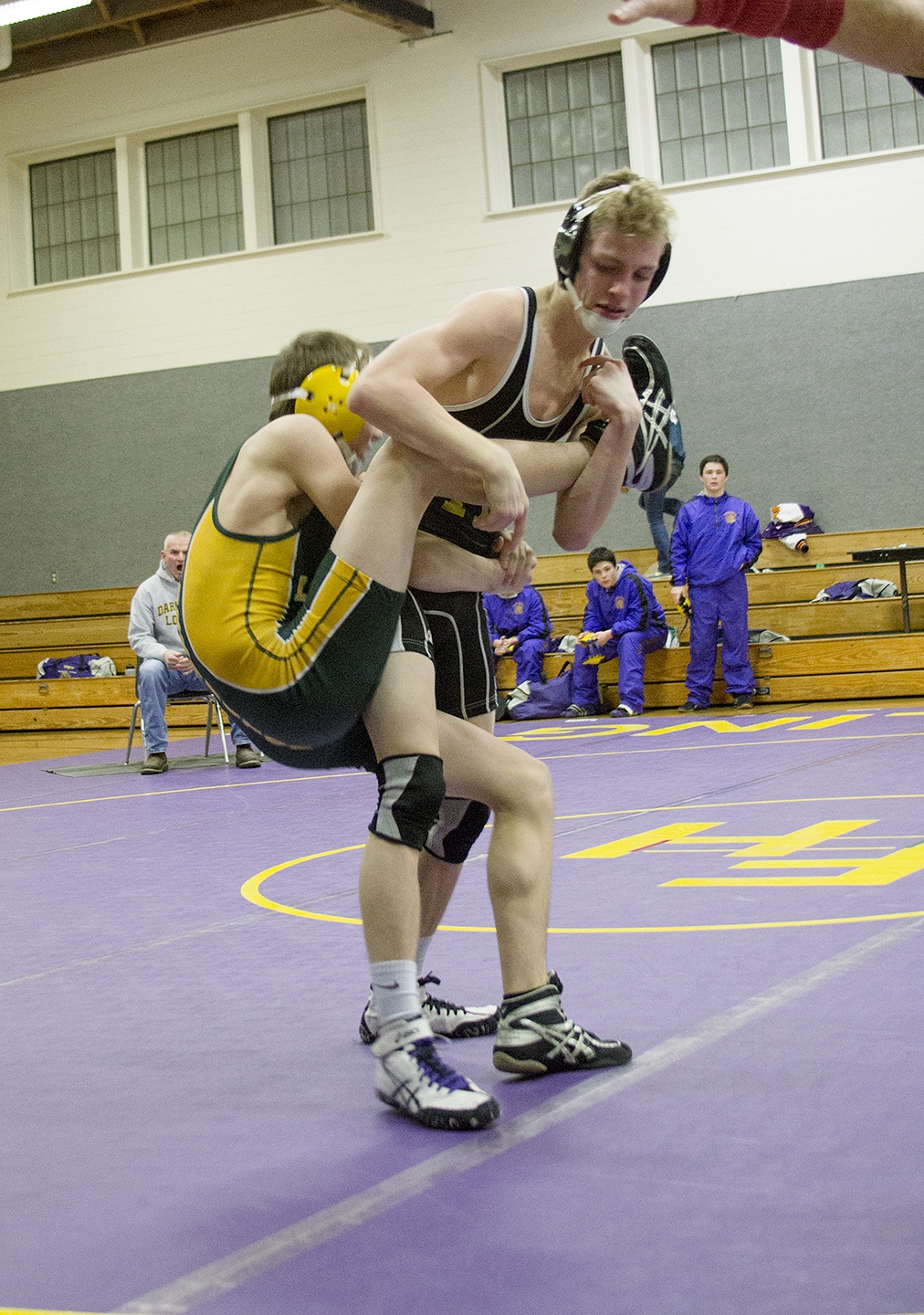 Staff photo/Greg Sellentin                                Senior James Guard works the single leg takedown.