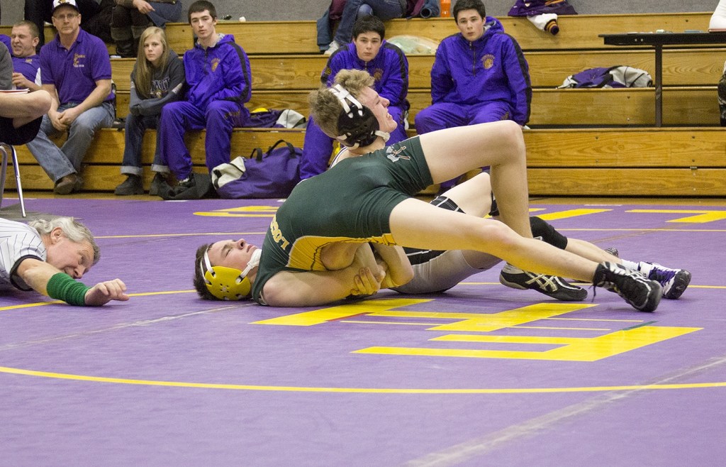 Staff photo/Greg Sellentin                                James Guard sets up and puts in a deep double arm bar.