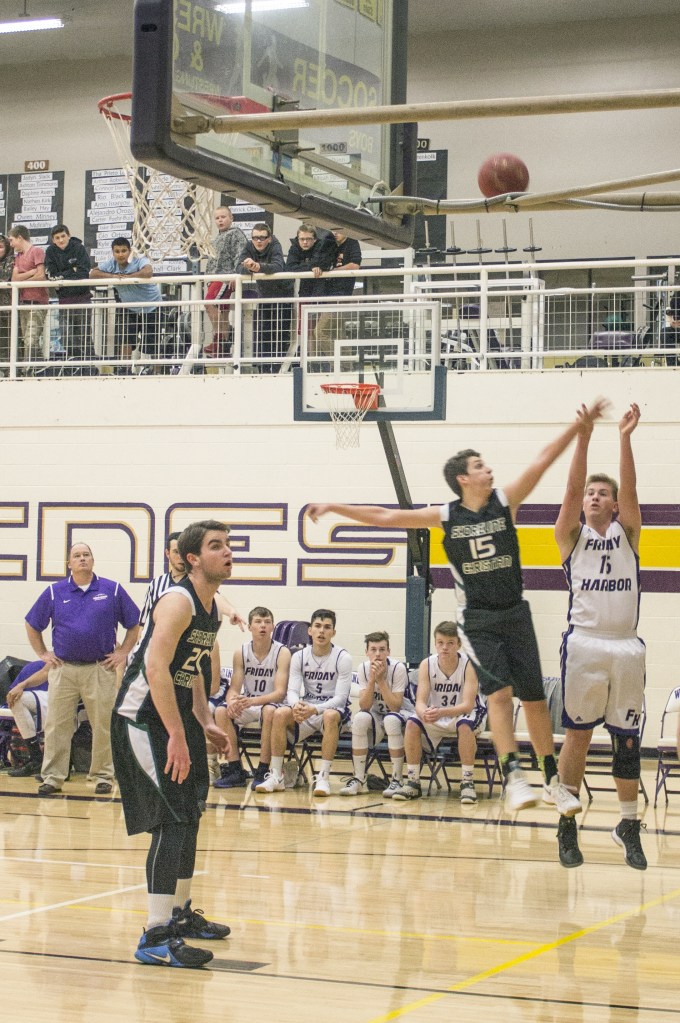 Staff photo/Greg Sellentin                                Senior Joe Stewart sinks a 2 point jump jump shot.