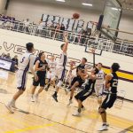 Staff photo/Greg Sellentin                                Senior John Gustafson grabs a rebound and scores.