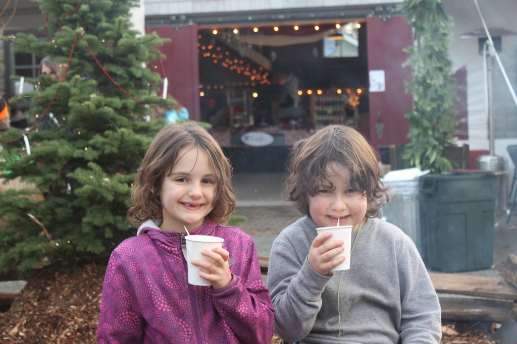 Staff photo/Hayley Day                                Kids sip hot chocolate at Brickworks Old-Fashioned Christmas Market.