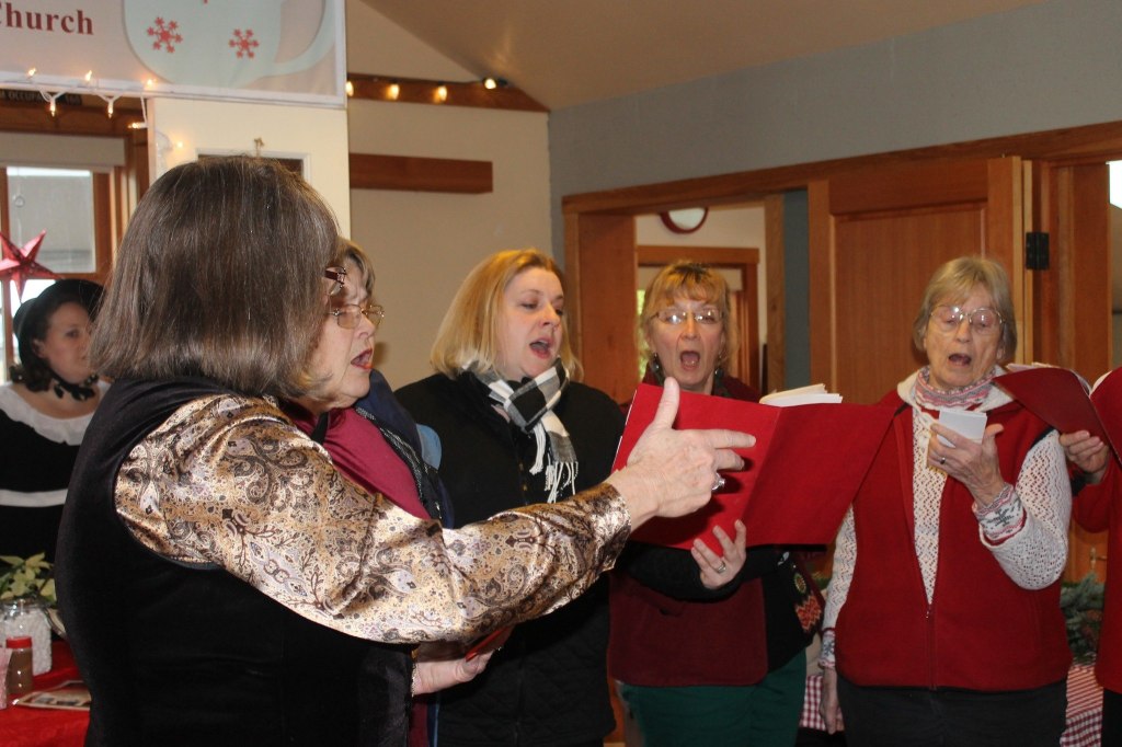 Staff photo/Hayley Day                                The Islands Chordsman Plus sing at Brickworks Old-Fashioned Christmas Market.