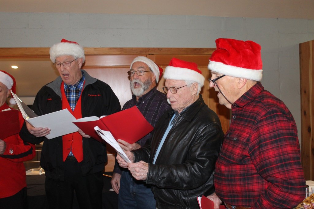 Staff photo/Hayley Day                                The Islands Chordsman Plus sing at Brickworks Old-Fashioned Christmas Market.