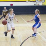 Staff photo/Greg Sellentin                                Hannah Hopkins brings the ball down court.