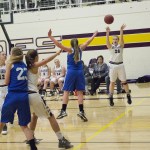 Staff photo/Greg Sellentin                                Hannah Hopkins shoots from the outside.