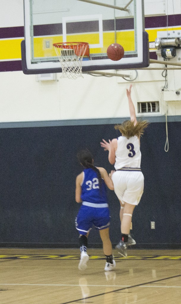 Staff photo/Greg Sellentin                                Junior Savannah Hoffman scores on a breakaway layup.