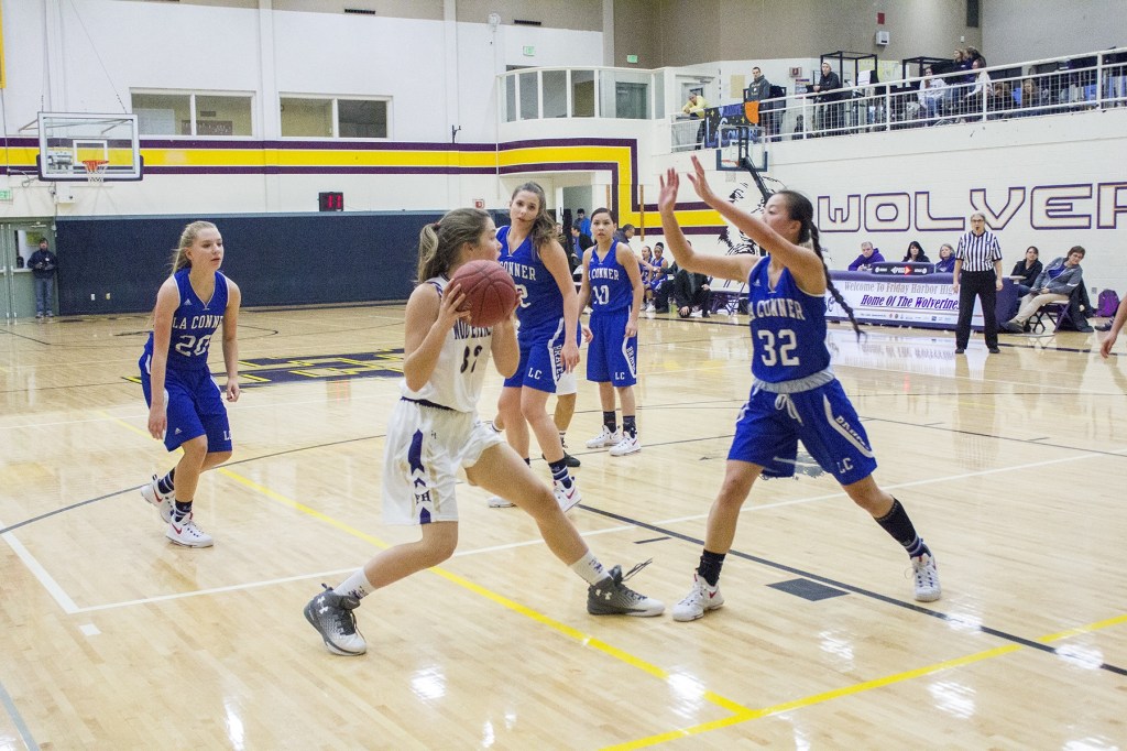 Staff photo/Greg Sellentin                                From left to right: Freshman Bailey Lambright looks to pass to an open player under the basket; junior Ciera Bailey moves through strong defense; senior Alexa Mora is open for a three-point attempt.