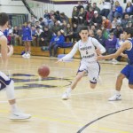 Staff photo/Greg Sellentin                                Senior Andy Stromberg passes to Eli Cooper-West.