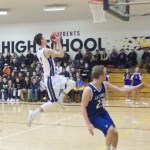 Staff photo/Greg Sellentin                                Senior Eli Cooper-West makes a breakaway layup.
