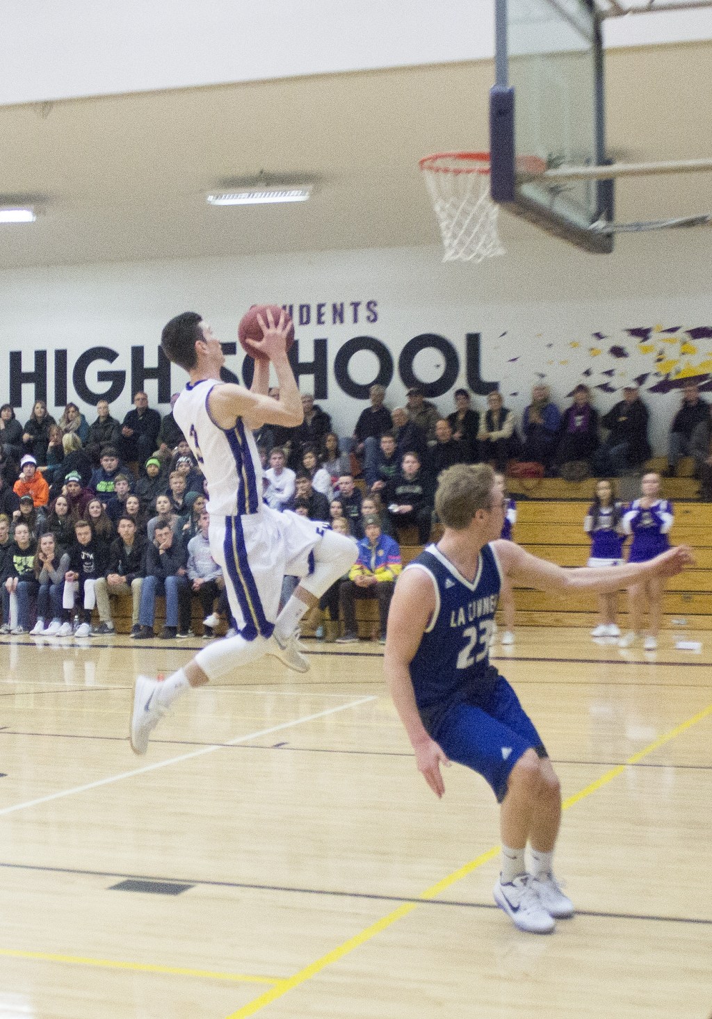 Staff photo/Greg Sellentin                                Senior Eli Cooper-West makes a breakaway layup.