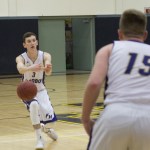 Staff photo/Greg Sellentin                                Eli Cooper-West, the game&rsquo;s high scorer, passes the ball to teammate Joe Stewart in the first quarter.