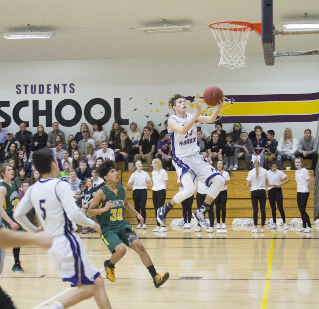 Staff photo/Greg Sellentin                                Jake Lowe scores on a breakaway layup in the first quarter.