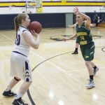 Staff photo/Greg Sellentin                                Hannah Hopkins attempts a three-point shot in the first quarter.