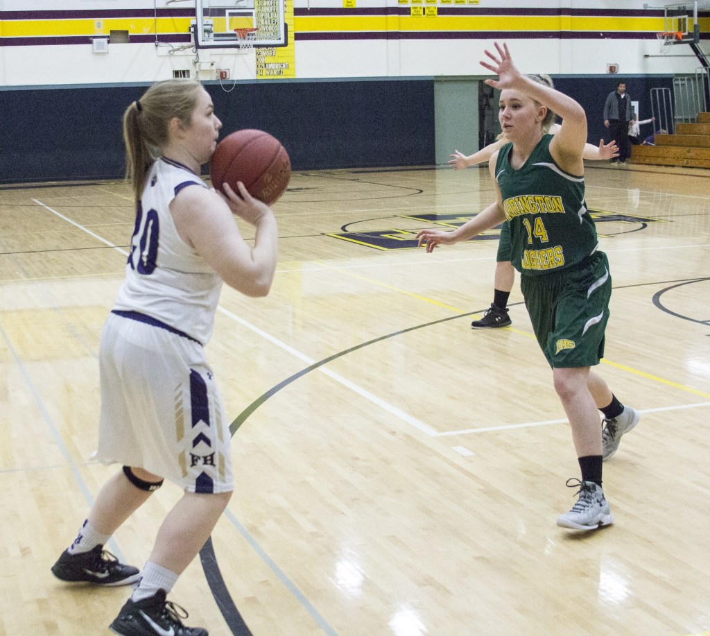 Staff photo/Greg Sellentin                                Hannah Hopkins attempts a three-point shot in the first quarter.