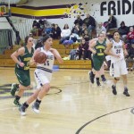 Staff photo/Greg Sellentin                                Kiana Woods brings the ball down court.