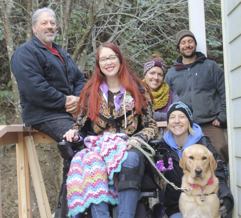 Staff photo/Hayley Day                                From left to right: Don Bryan, Dani Davis-Robeson, Brittini Bryan (back), Laura Davis-Robeson, Richard Low and Kailee the service dog pose on the finished ramp on Jan. 15.