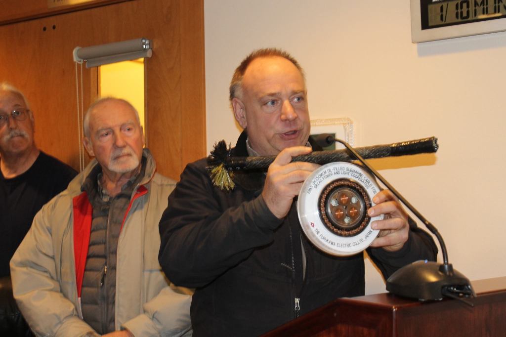 Staff photo/Hayley Day                                Joel Mietzner, of OPALCO, shows examples of CenturyLink&rsquo;s frayed fiber cable (top) and OPALCO&rsquo;s replacement power and fiber cable (bottom).