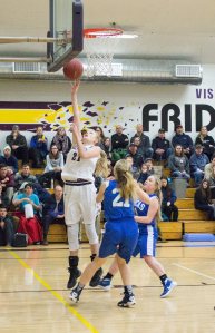 Staff photo/Greg Sellentin                                Hayden Mayer drives to the basket and scores on a layup.