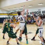 Staff photo/Greg Sellentin                                Kiana Woods makes an inside jump-shot under heavy defense.
