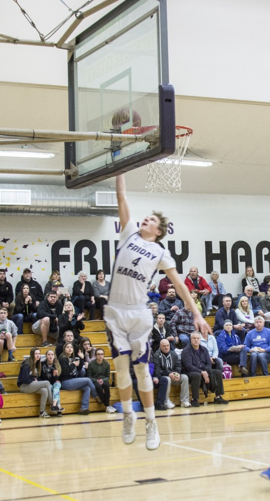 Staff photo/Greg Sellentin                                Junior Isaac Mayer scores.