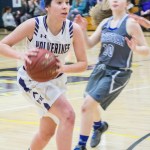 Staff photo/Greg Sellentin                                Junior Kiana Woods moves the ball down court.
