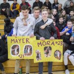 Staff photo/Greg Sellentin                                Senior basketball star John Gustafson and Wolverine wrestler James Guard stayed around after the game to support the girls&rsquo; team.
