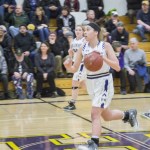 Staff photo/Greg Sellentin                                Kiana Woods moves the ball down court.