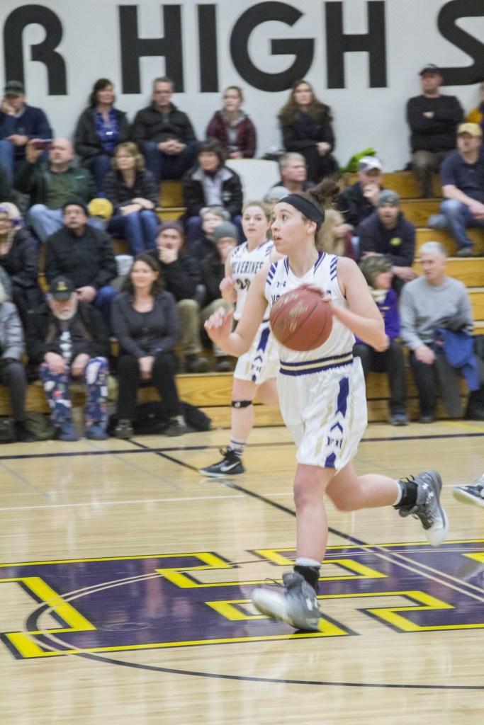 Staff photo/Greg Sellentin                                Kiana Woods moves the ball down court.