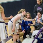 Staff photo/Greg Sellentin                                Senior Hannah Hopkins, and the other Wolverine players, offer support to a Mount Vernon player who was injured in the last-minute of play.