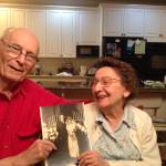 Contributed by Rae Kozloff. Eugene and Anne Kozloff showing off their wedding photo.