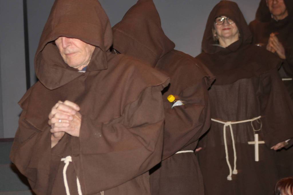 Staff photo/Hayley Day                                The Rotary Club &ldquo;monks&rdquo; solemnly enter the theater.